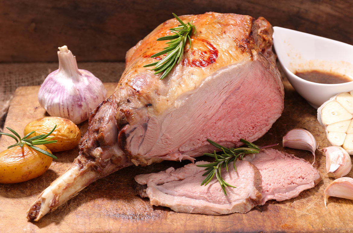 Slow roasted leg of lamb with braised fennel and onions